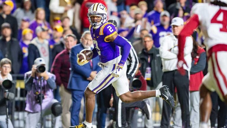 LSU football player Kyren Lacy turned himself in to police after his role in a fatal car accident