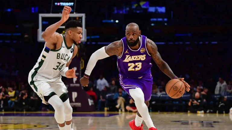 Giannis gives flowers to LeBron James after beating the Lakers
