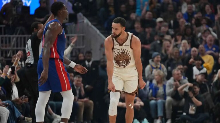 Stephen Curry takes a trick shot off a laser pass from Draymond Green