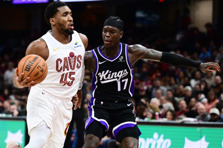 Donovan Mitchell and Evan Mobley defend for the Kings