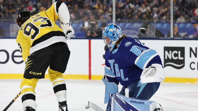 Andrei Vasilevskii, Jeremy Swaiman throw mowers during the stadium series