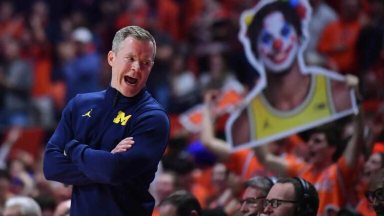 Dusty Mai shares a hilarious moment with the players after the win over Illinois